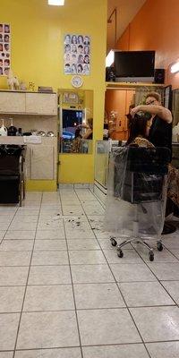 Alma cutting hair.  You want a welcoming environment this is the place!  She is freaking amazing!