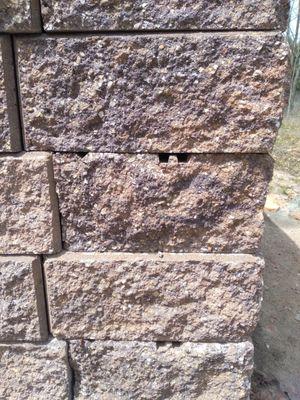 The corner wall stones show the cuts. The blocks are not stacked in alignment.