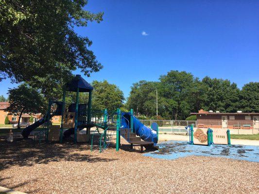 View of playground and wading pool/splash pad.