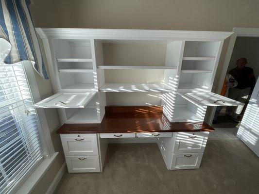 Custom office desk with lift doors and stained maple desktop