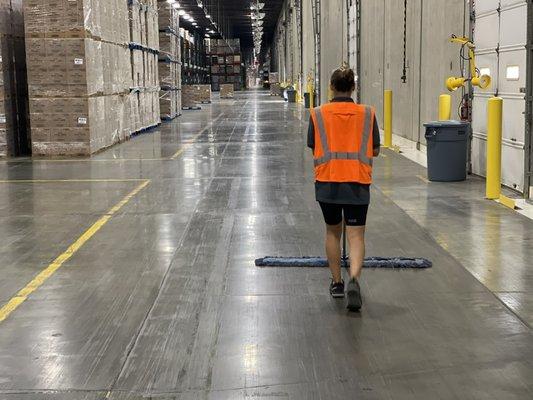 Warehouse floor sweeping and scrubbing