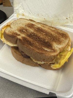 Breakfast Sandwich: 2 eggs, cheddar cheese, bacon, Rye Bread