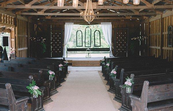 Beautiful antique church pews and hardwood floors make this rustic barn the perfect place to say I DO!