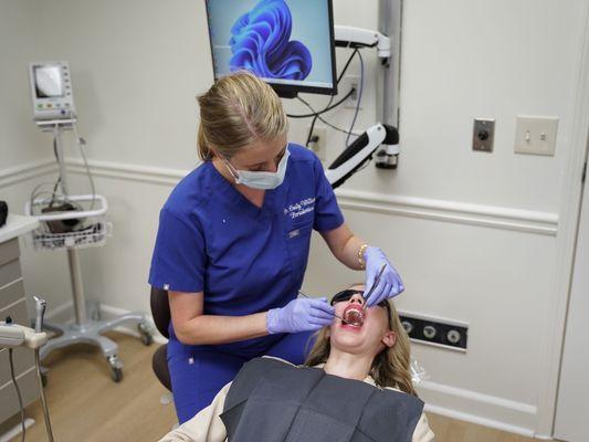 Dr. Williams doing an exam in a patient