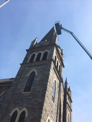 Lee's crew making repairs to steeple. Springfield Baptist Church.