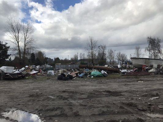 A junk yard next to the parking lot