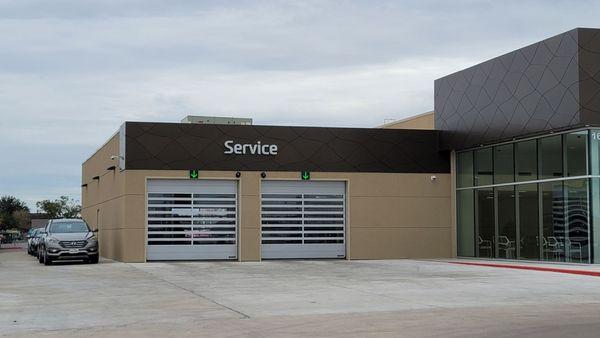 For service,  drive up to the green arrow, and the door will open for you to drive your car in.