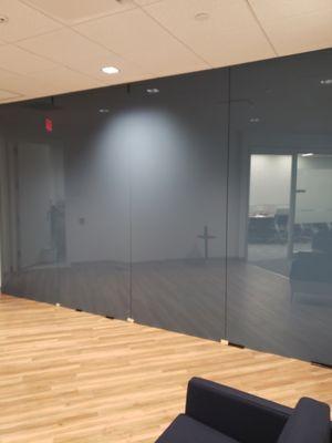 A wall cladded in back painted tempered glass (spandrel)