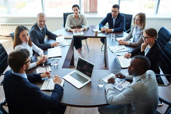 Roundtable full of business professionals hard at work