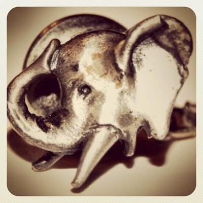 Elephant head tie tack with trunk up for good luck