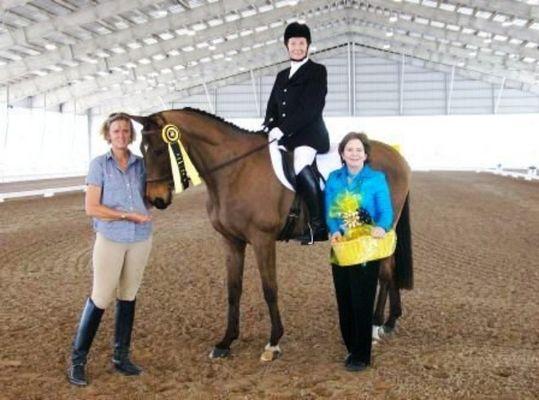 Dru N., her horse Law & Order (AKA Dreamer), and student, Lillian Floyd, being inducted into the American Dressage Foundations Century Club