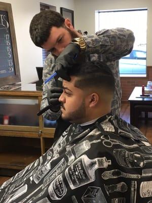 Tom the Barber. Doing a mid bald fade.