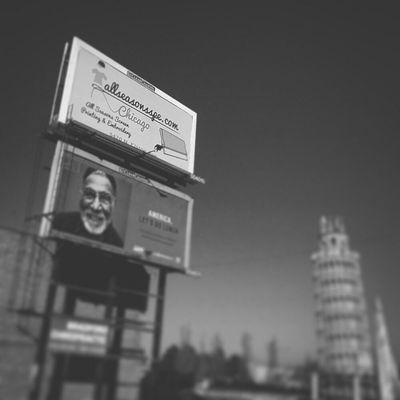 All Seasons billboard by the leaning tower of niles