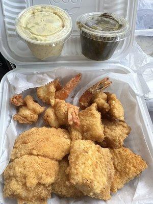 Catfish and shrimp platter with potato salad and collard greens