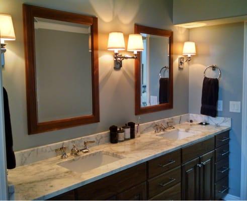 Bath remodel with custom walnut cabinets, Calacata marble countertops