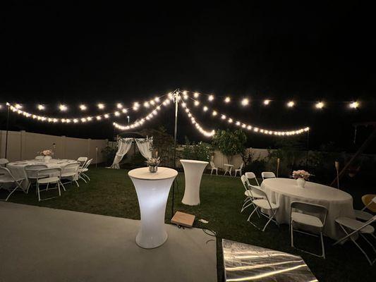 Cafe lighting tables chairs and covers with lighted cocktail tables