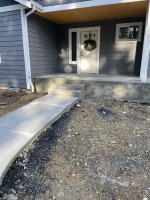 Concrete sidewalk and front porch