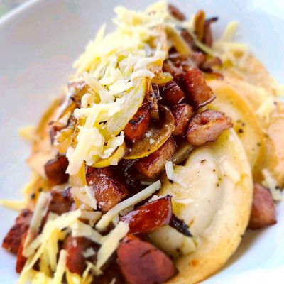 Perogies w/ carmelized onions, sautéed kielbasa, sauteed baby bellas, shredded sharp cheddar cheese