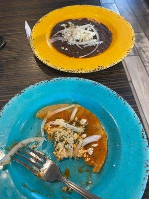 Hard tortilla with a salsa and cheese and hard tortilla with black beans