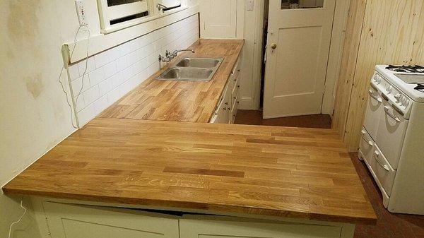 Installed new butcher block countertop and tile backsplash