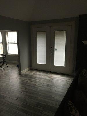 Oversized French patio door and ceramic tile installation.