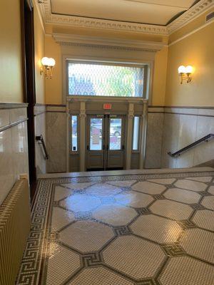 Leaded windows, mosaic floor.