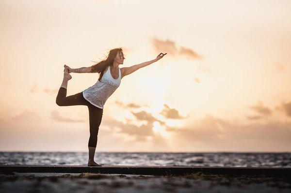 Summer beach yoga is a great way to start the day!