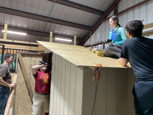 Charlotte, Eagle Scout candidate working on roof of her Whelping house for Knine Rescue (beneficiary)