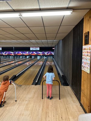 Kids bowling with aimers and bumpers