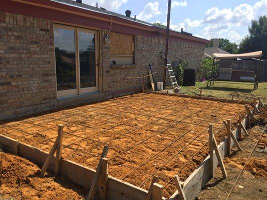 Removed old wood deck framed 20'x16' patio slab w/ rebar