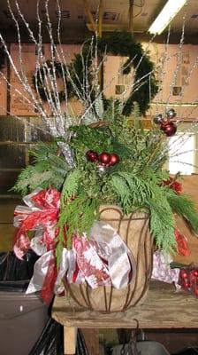 Our wrought iron basket overflowing with fresh greens.  Bu it this year; bring it back the next for a refill.