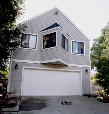 The house after Paul and his crew finished with new siding and windows.  Exceptional work.