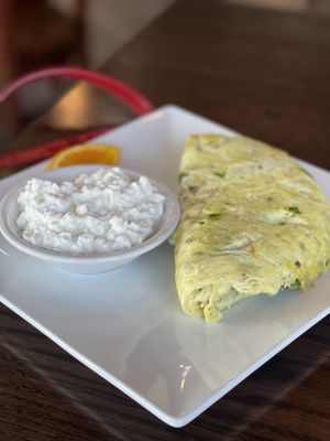 Egg white omelet with a side of cottage cheese (yellow egg was because of butter !! So much for eating lite !!)