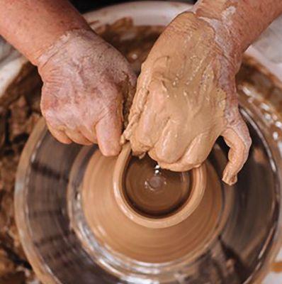 Jill Hinckley throwing a pot.