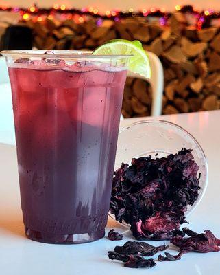 Refresh your day with our Hibiscus Iced Tea, a tangy splash of color in your glass! #JamaicaRefresh #DosBatosDrink