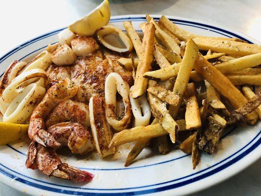 Seafood platter special with flounder, shrimp, calamari, scallops. I chose fries for my side - amazing!