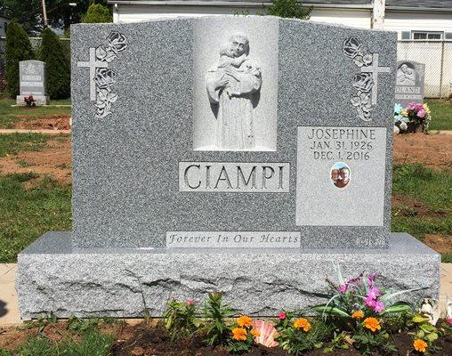 Exquisite hand carving of St. Anthony with Child, installed at St. Peter's Cemetery, Staten Island