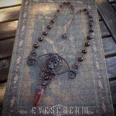 Eyescream Jewelry Original Skull Eye Talisman with Lovely Garnets. From the Copper Alchemy Collection.