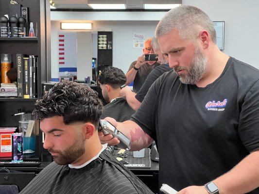 Alex the owner hard at work... Ward's Barber Shop, Portland, Maine