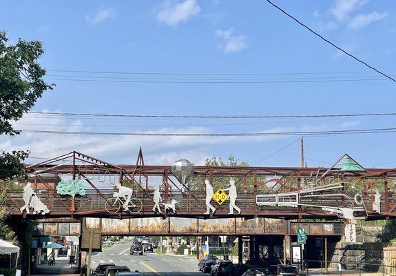 Decorated Bridge over main st with parking underneath