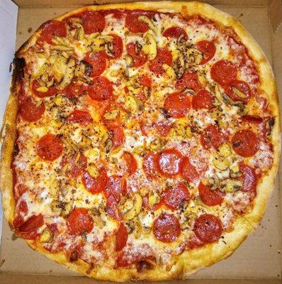 Large pepperoni and mushrooms pizza.