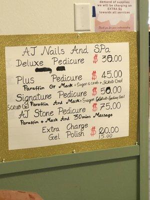 Prices posted on the wall by the pedi chairs... hard to read and vague.