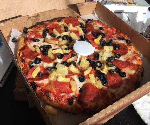 Pepperoni, pineapples, and black olives. All done very well!