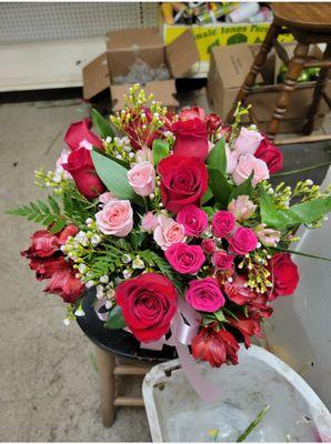 birthday arrangement of roses, spray roses, and alstroemerias