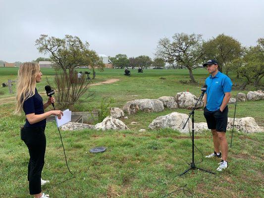 Kira K. Dixon interviewing Jordan Spieth at a socially safe distance.