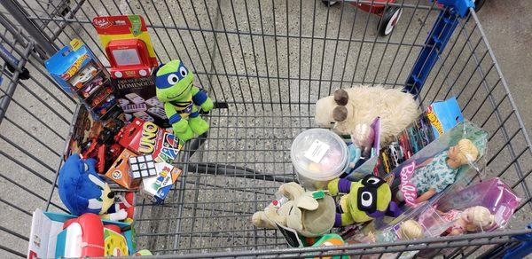 Left side 10 toys chosen by my eldest daughter, right side 10 toys chosen by my youngest daughter for 2023 Ronald McDonald Toy Drive