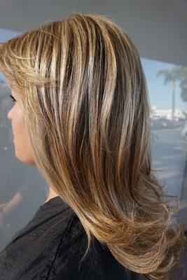 Cool blonde highlights with medium blonde root touch up.