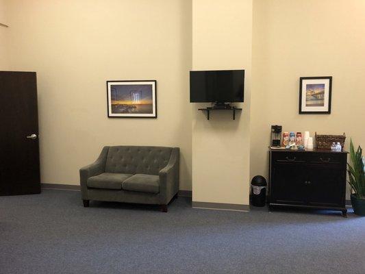 Lobby w/ big comfy seating as well as TV and snacks