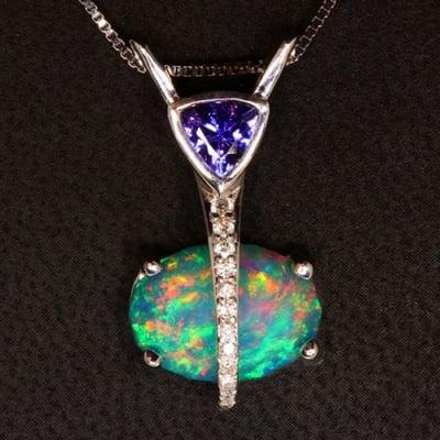 In-house designer Christopher Michael designed this Custom Tanzanite, Opal, and Diamond Pendant.