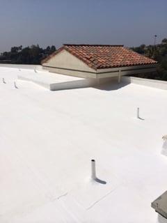 White solar reflective elastomeric roof upgrade coating